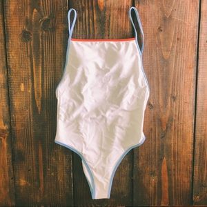 NWOT White one piece with blue and orange trim.